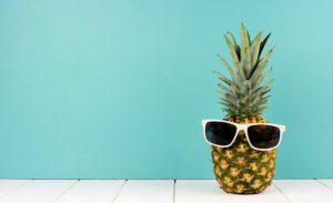 A pineapple wearing sunglasses.
