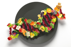 Fruits and vegetables in the shape of a DNA on top of a plate.